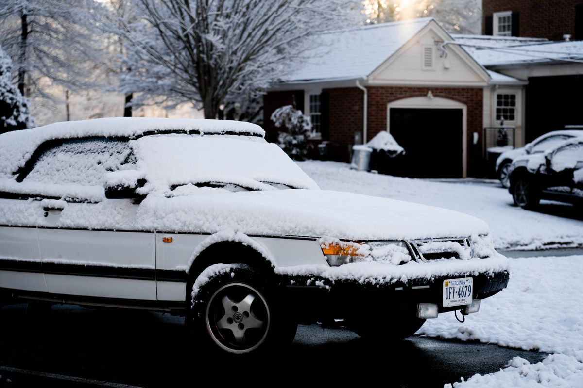 Car buried under snow after a heavy storm